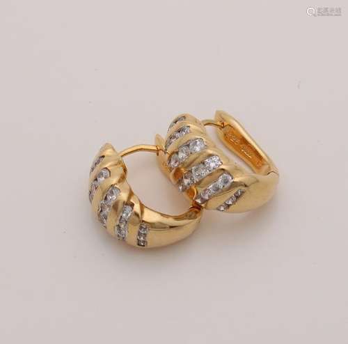 Creoles, gold on silver with zirconia's. Hinged creoles