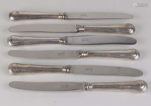 Six knives with silver contoured handles with heart