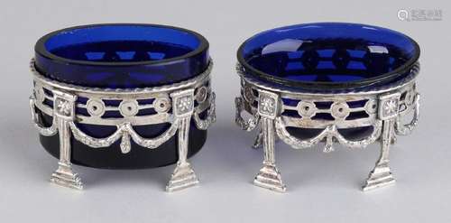 Two salt cellars with blue glass and silver holder,