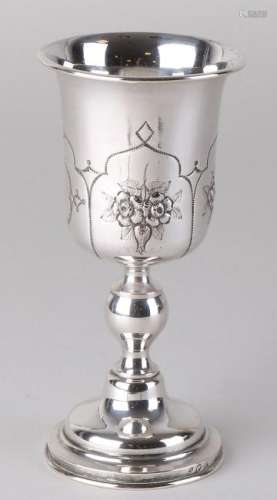 Silver chalice with flower decoration and a trembled