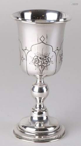 Silver chalice with flower decoration and a trembled