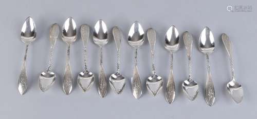 Twelve silver teaspoons, 835/000, with a pointed bowl,