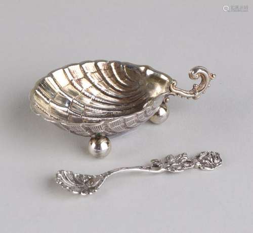 An 800/000 silver shell-shaped salt cellar with gilding