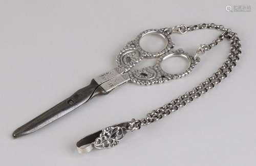 Antique scissors with silver handles and chain with