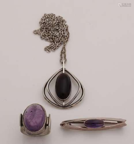 Silver jewelry with purple stone, a ring with an oval