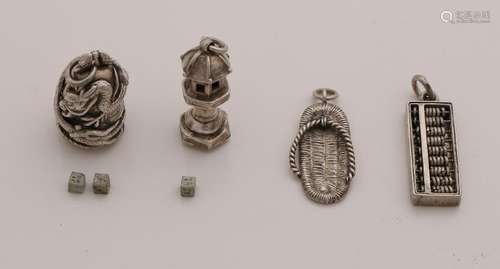 Four Chinese silver charms, with an abacus, a tatami