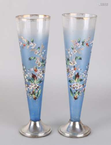 Opaline vases with imposed floral decor, placed on a