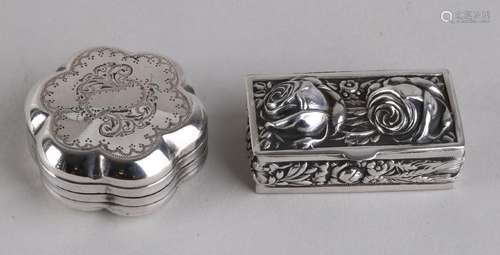 Two silver pill boxes, a round scalloped model adorned