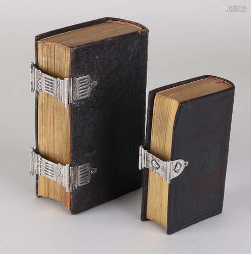 Two Bibles with silver. Bible with a dark brown case