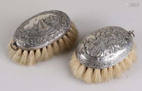 Two silver table brushes, 833/000, oval model one with