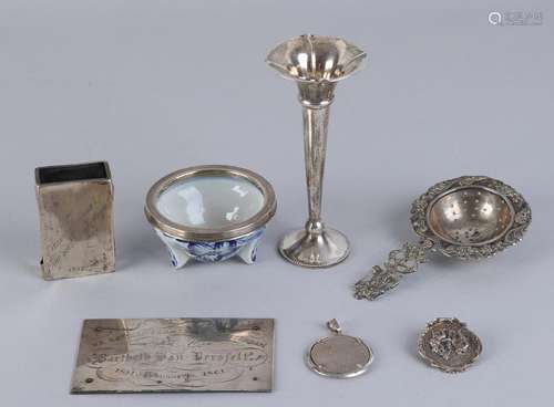 Lot of silver, with a silver tea strainer on a