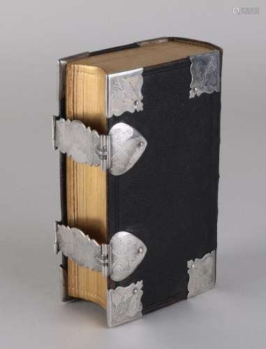 Bible with worked leather cover with silver corner