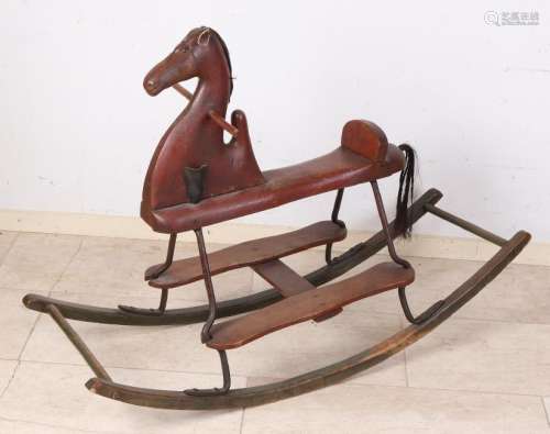 Antique rocking horse. Made from wood, leather and