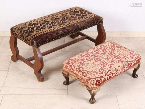 Two upholstered footstools. One time mahogany, circa