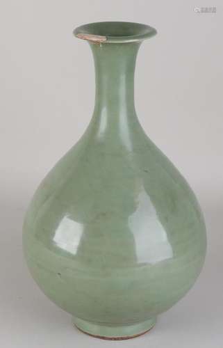 Ancient Chinese porcelain celadon vase. Bottom edge