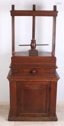 Early 19th century oak linen press with base cabinet.