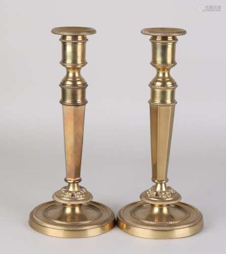 Two heavy 19th century brass candle holders in Empire