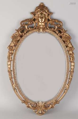 Oval brass mirror with portrait. 20th century.
