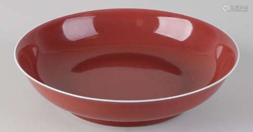 Ancient Chinese Sang de Boeuf dish with bottom mark.