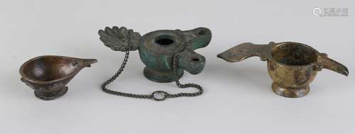 Three antique bronze oil lamps. Very old. Size: 6 - 11