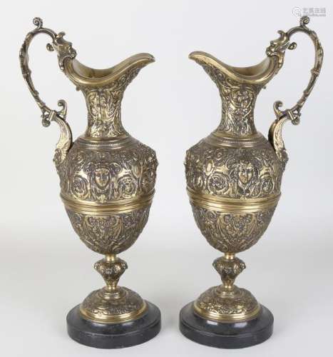 Two large antique bronze historicism jugs on marble