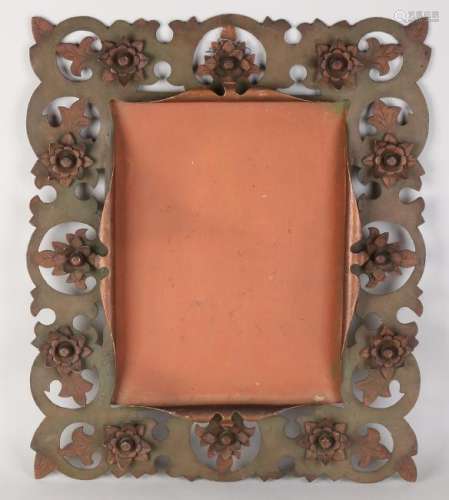 Antique metal mirror frame with rosettes. 19th - 20th