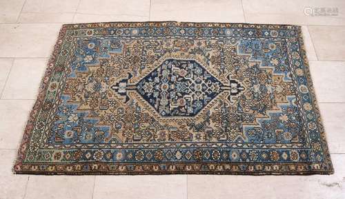 Old Persian rug, with blue etc. and floral decors.