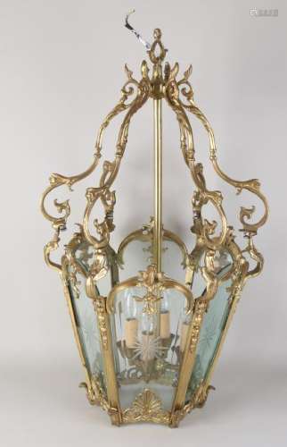 Old bronze hanging lamp with six faceted glass windows.
