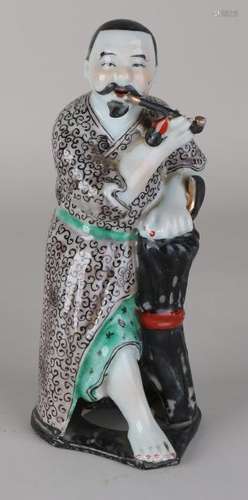 Old / antique Japanese porcelain man with opium pipe.