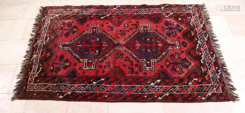 Old persian rug. In the colors red / black / cream.