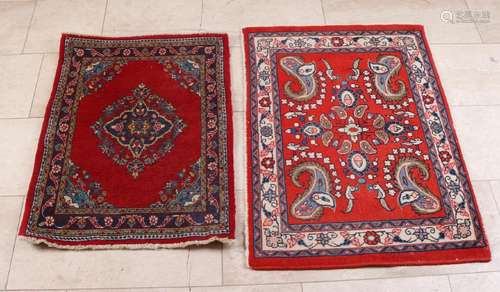 Two hand-knotted carpets. One carpet from Ardekan /