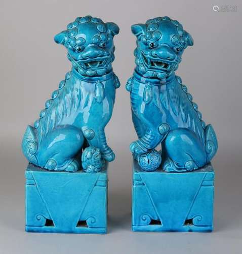 Two large old Chinese porcelain Foo dogs with blue