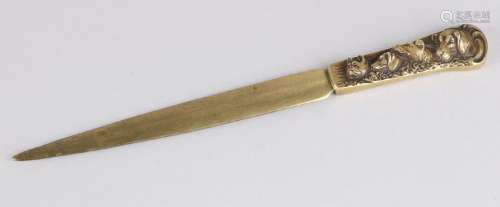Antique bronze letter opener with four dog heads.