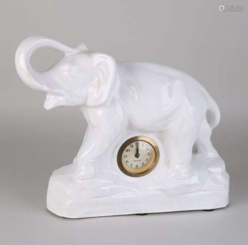 Old ceramic table clock. Indian elephant. With white