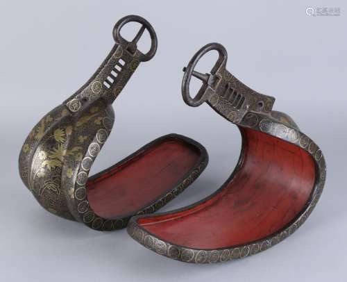 Two antique Japanese iron stirrups with copper inlaid.