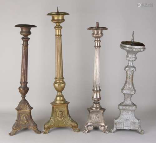 Four brass Baroque-style candle holders. 19th century.
