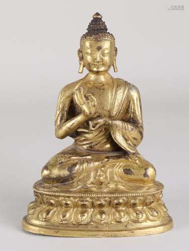 Old gilt Chinese bronze Buddha in lotus position. With