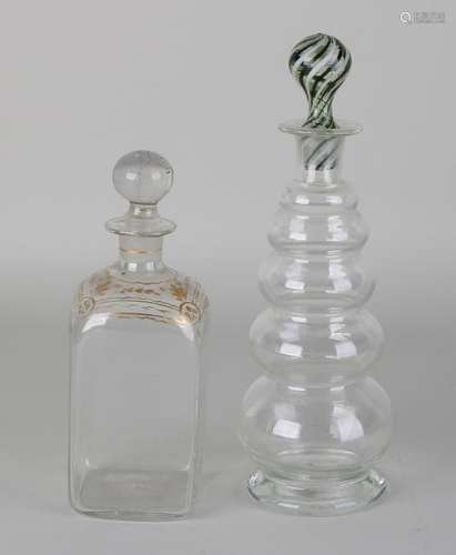 Two 19th century carafes. Once with gold decor, with