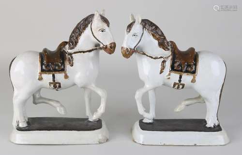 Two 18th-century Delft polychrome horses. Restored.