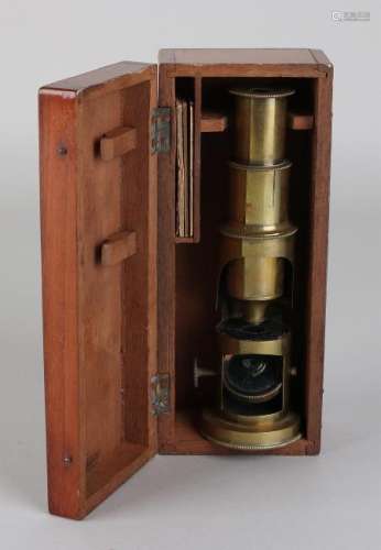 Antique brass microscope in walnut box. Circa 1900.