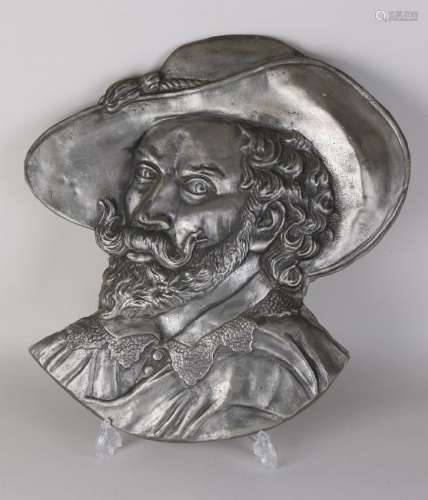 Large pewter wall plaque after an antique example. Man