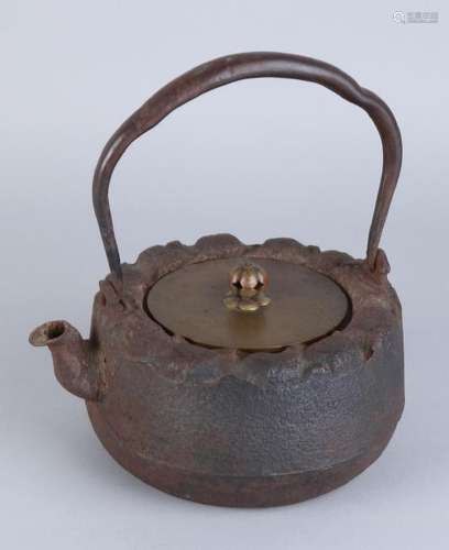 Antique Japanese iron water kettle with brass lid.