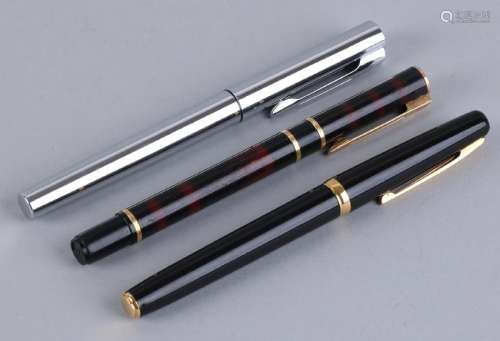 Three fountain pens from Aquarius, one with a golden