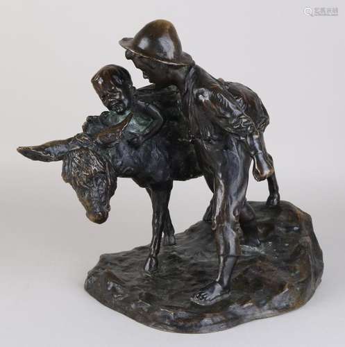 Antique bronze figure. Children with donkey. Circa