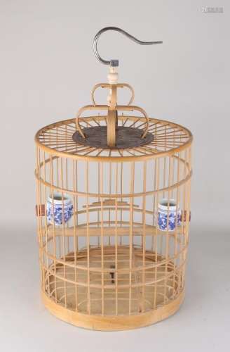 Ancient Chinese bird cage with porcelain cribs. Made