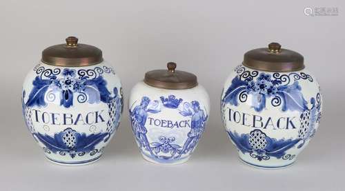 Three antique Dutch Delft blue tobacco pots with copper