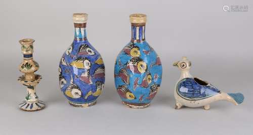 Four parts of Persian painted ceramics. 20th century.