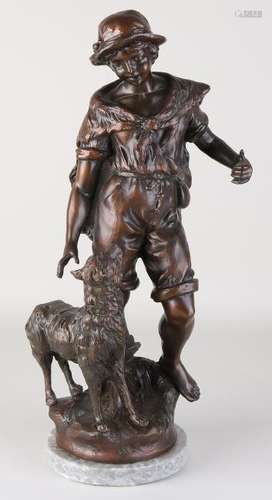 Antique French composition metal figure. Boy with dog.