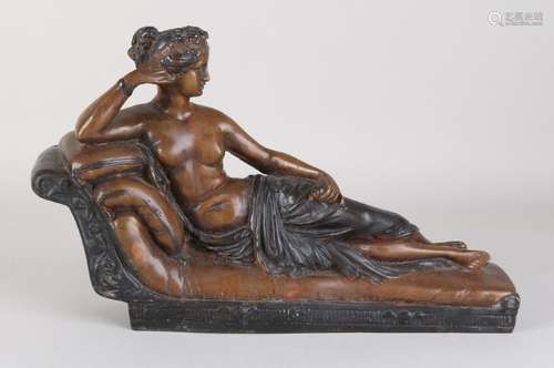 Antique bronze figure. Greek lady on chais longue.Â