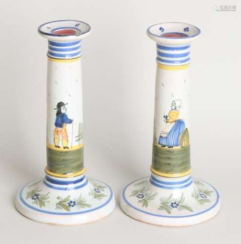 Two antique French polychrome Fayence candle holders.